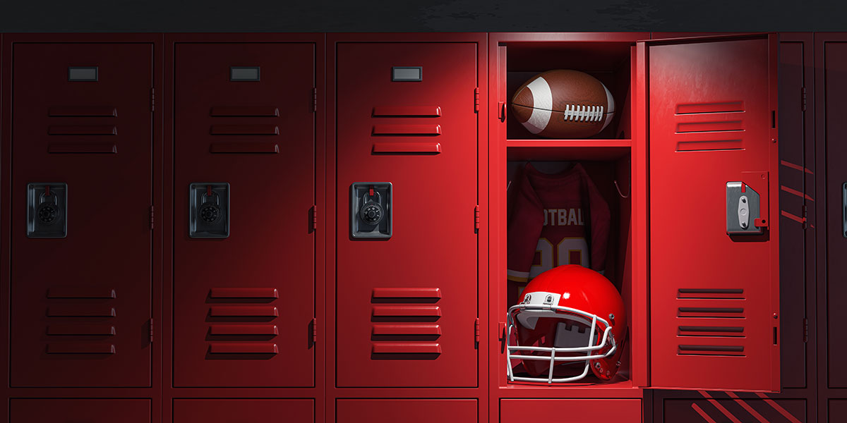 american football and helmet in red locker